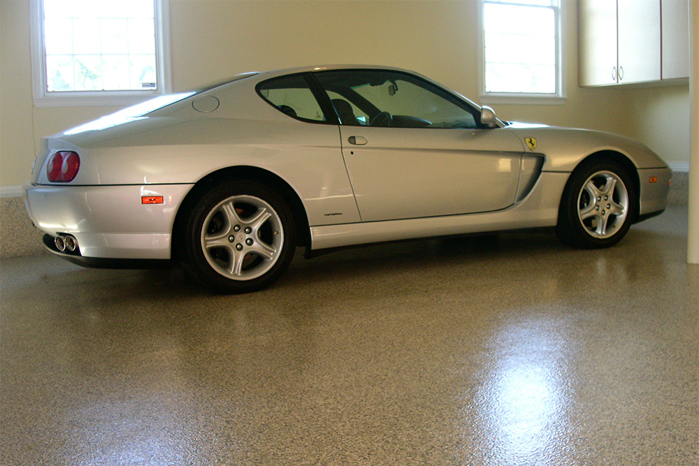 Porsche vehicle sitting on some of our Camarillo concrete stain and sealer work.